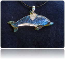 "Dichroic Dolphin". Flameworked Borosilicate Crystal Pendant with Blue Dichroic Sparkle. 